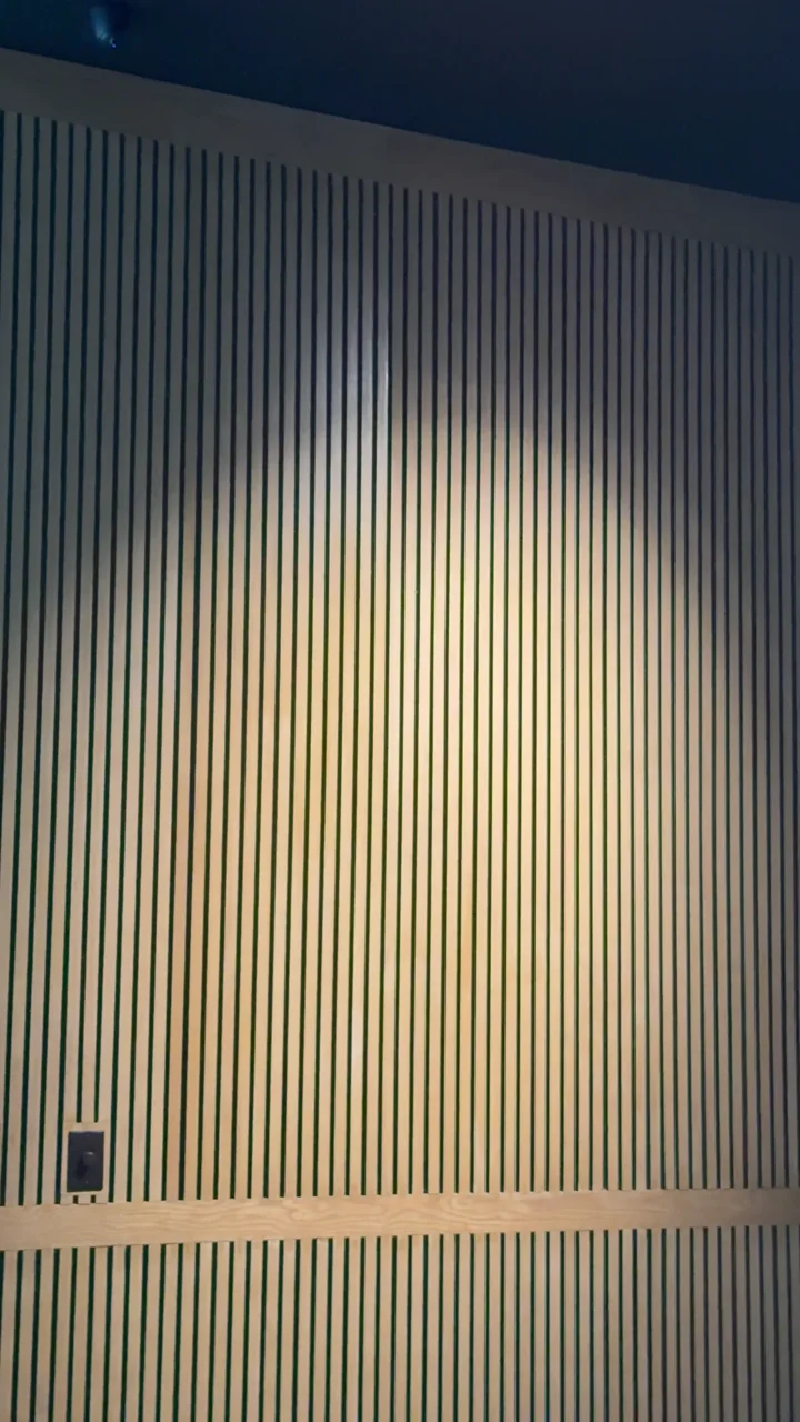 A close view of the timber slatted partition during fit-out